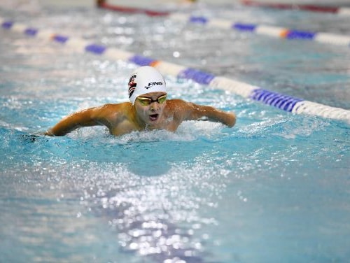 Swimmer in pool doing the backstroke